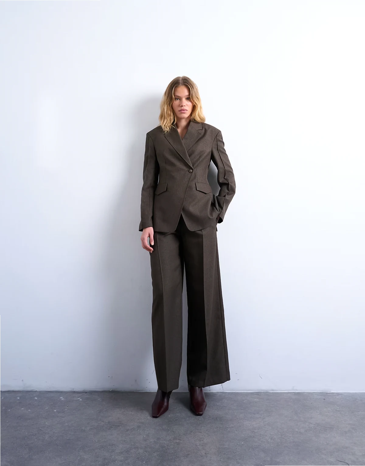 asymmetric wrap blazer with seam details in brown - part of a set