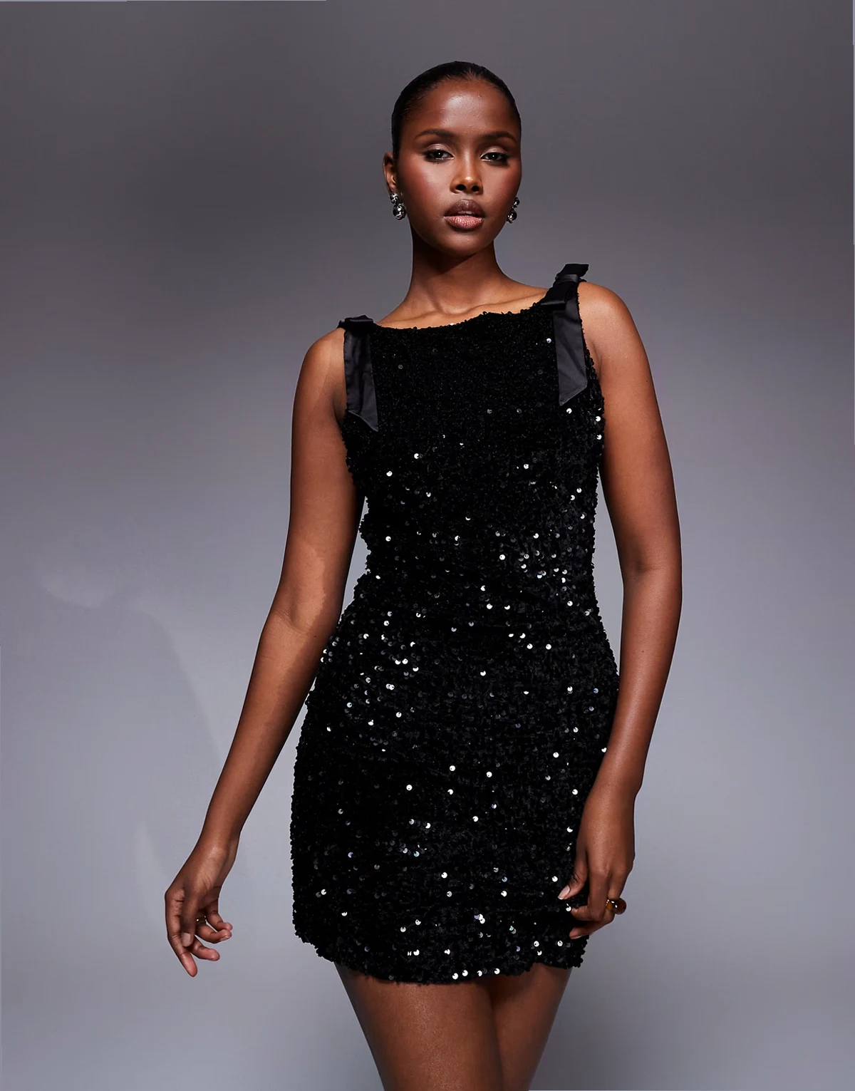 premium mini dress with v-back and shoulder bows in black sequin