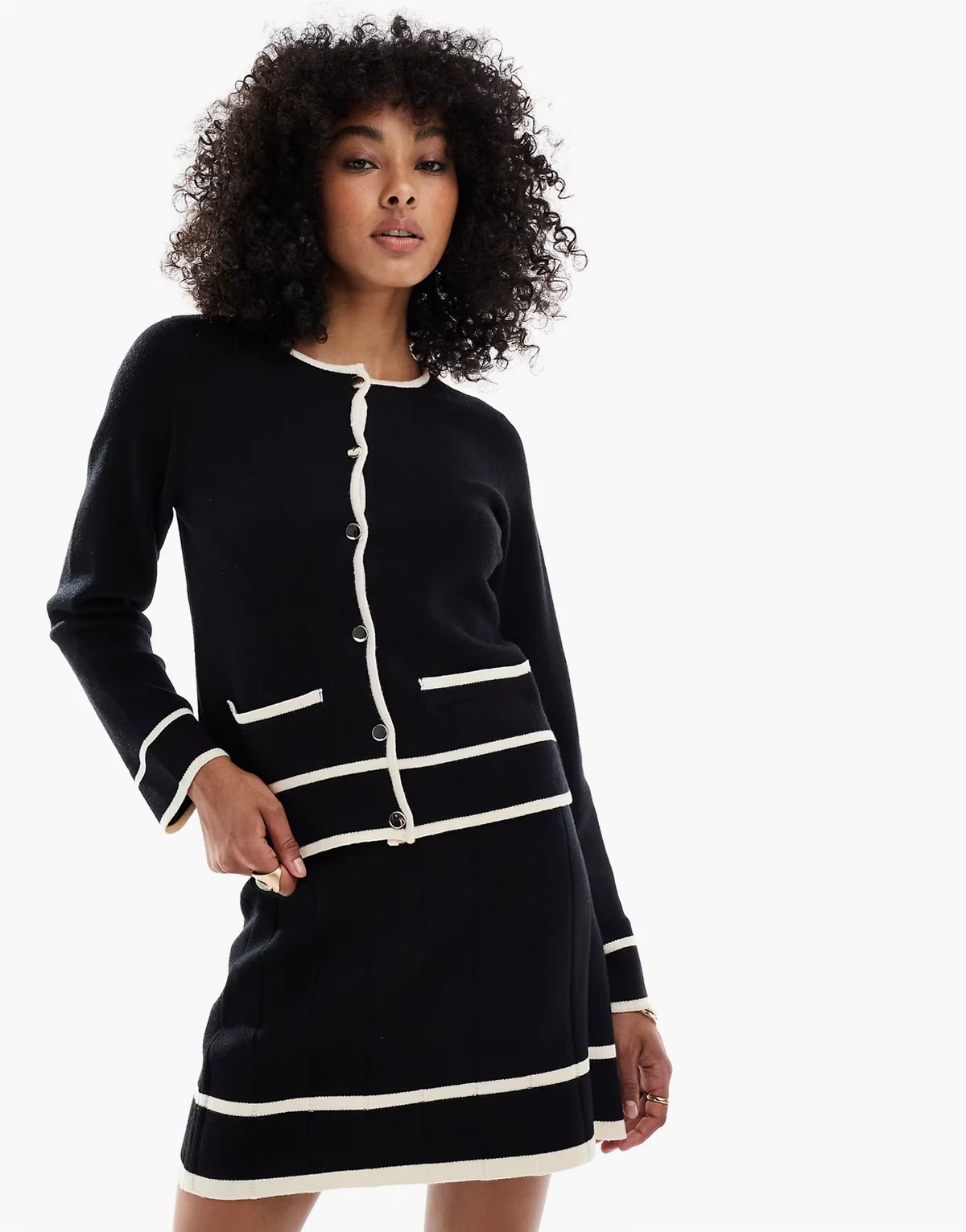 knit cardigan with contrast binding details in black and cream - part of a set
