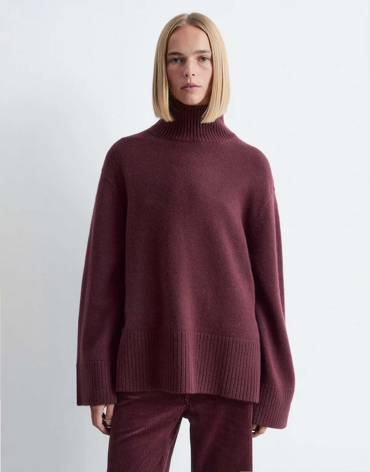 high neck relaxed knit sweater in burgundy plum
