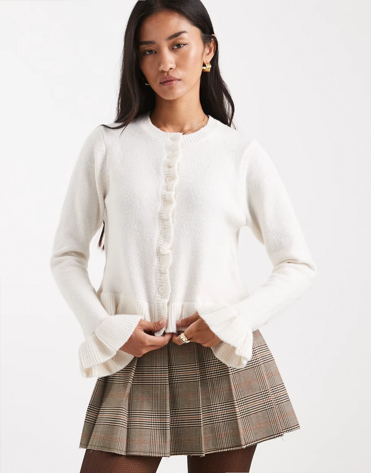 crew neck knit cardigan with ruffle cuffs and hem in ivory