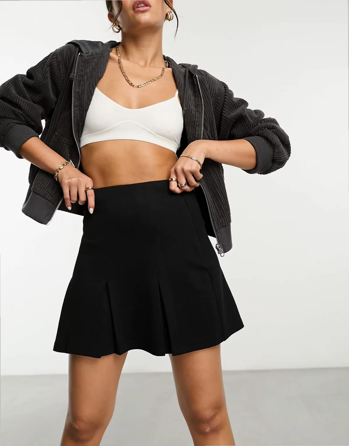 pleated jersey twill mini skirt in Black