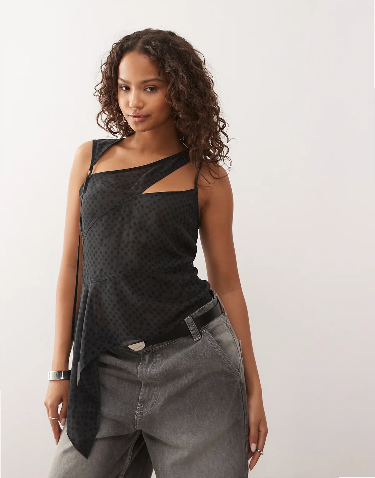 asymmetric cut away chiffon top in dark gray broken polka dot print