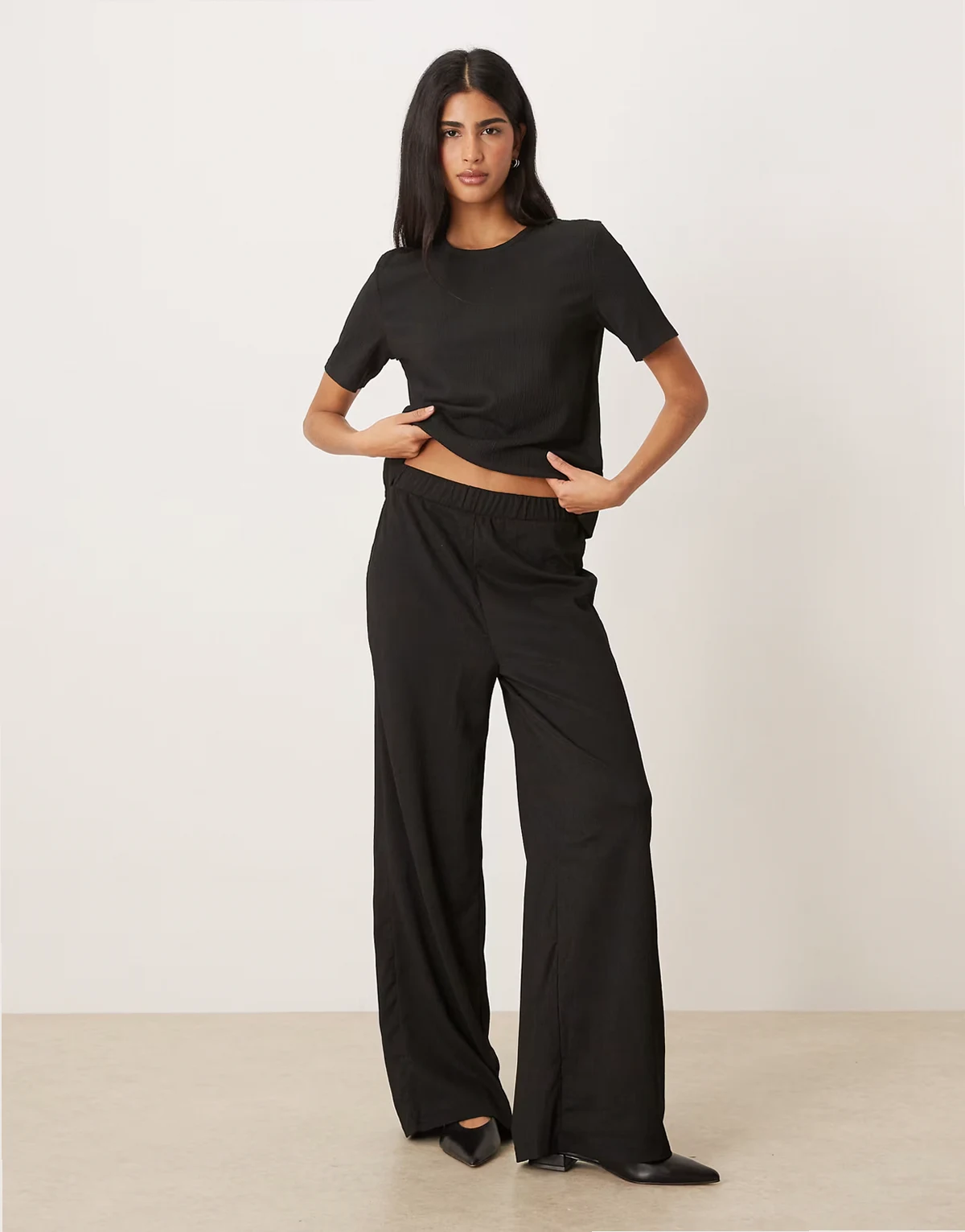 textured wide leg pants in black - part of a set