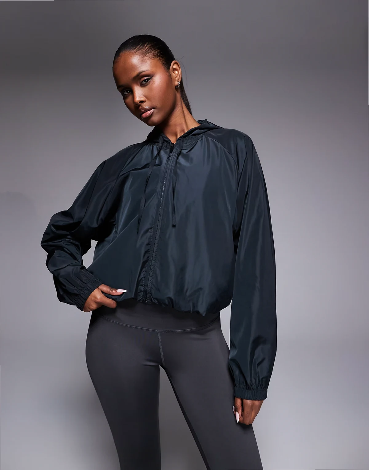 water repellent blouson running jacket with hood and zip pockets in black