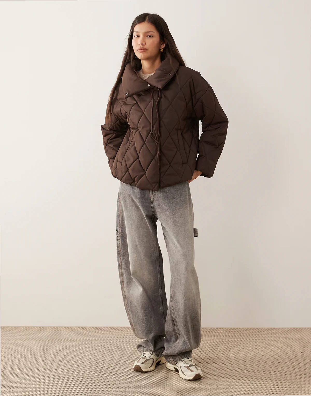 high neck quilted jacket with tie details in chocolate brown