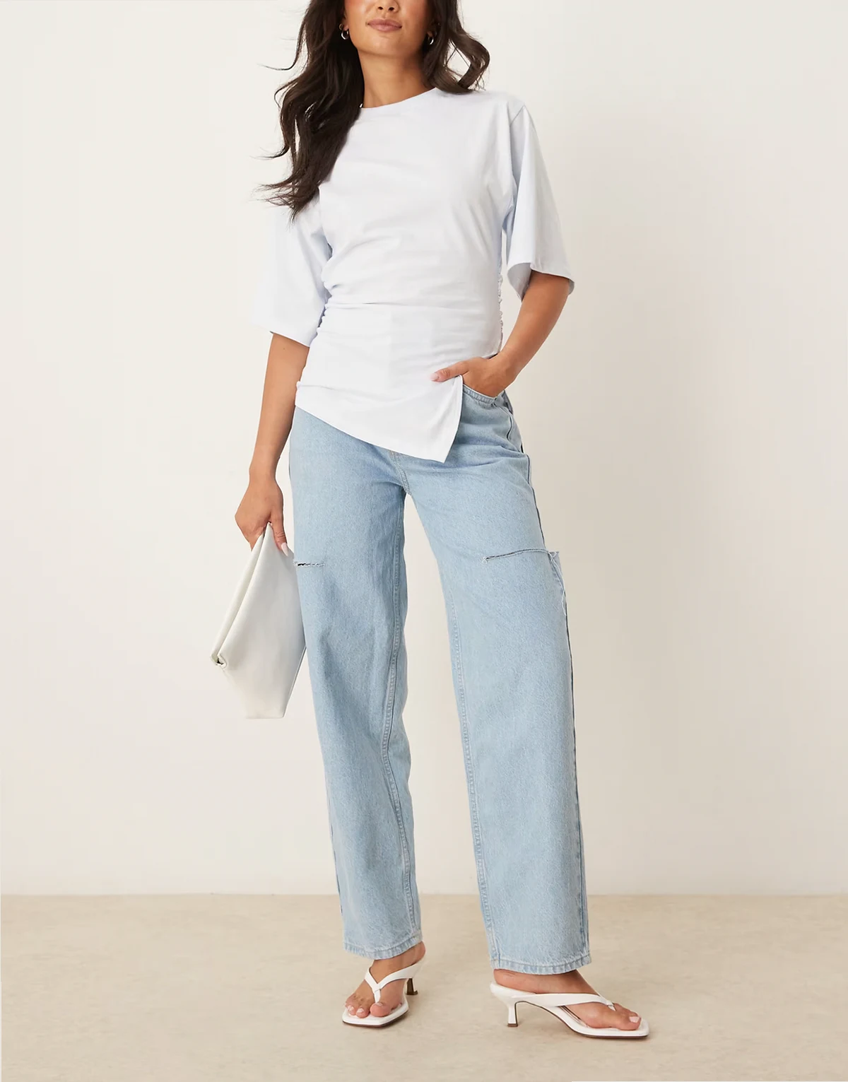 high waist barrel jeans with thigh rips in light wash