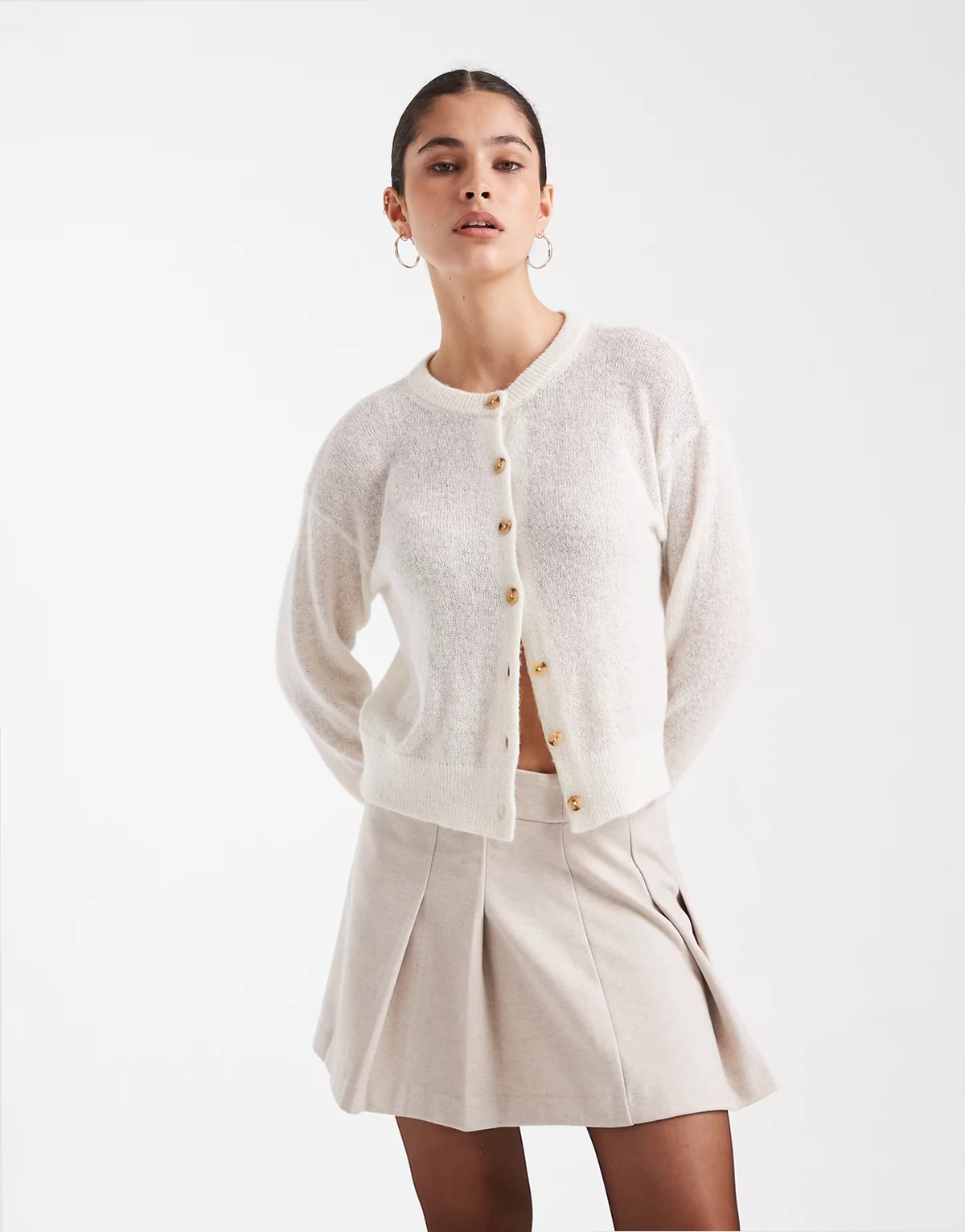 – Plissierter Minirock in Creme