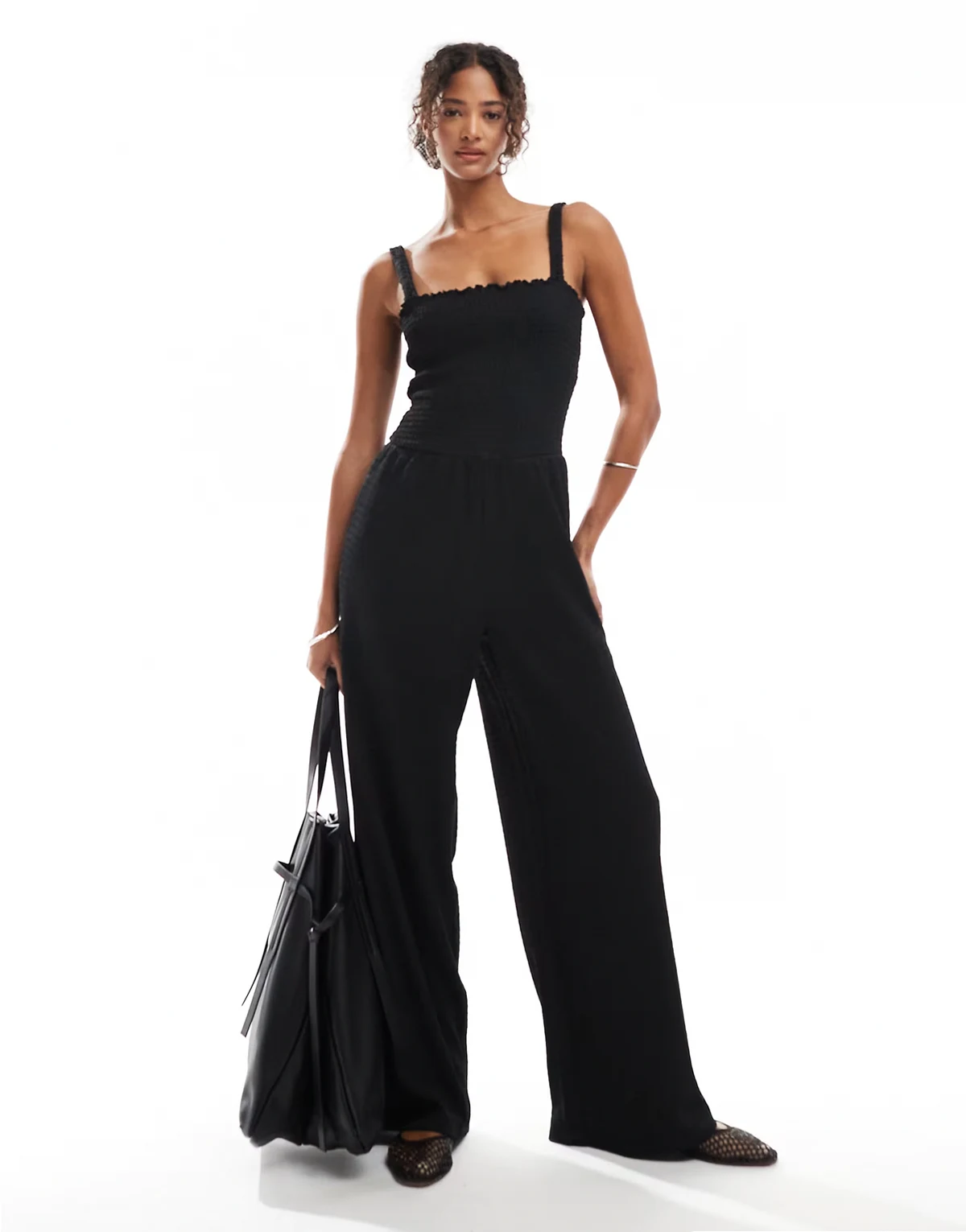 – Gesmokter Jumpsuit in Schwarz