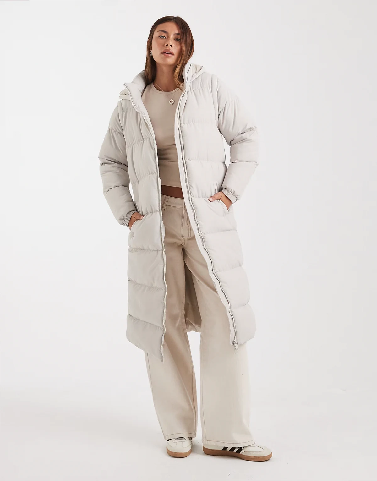 hooded padded maxi jacket with detachable sleeves in stone