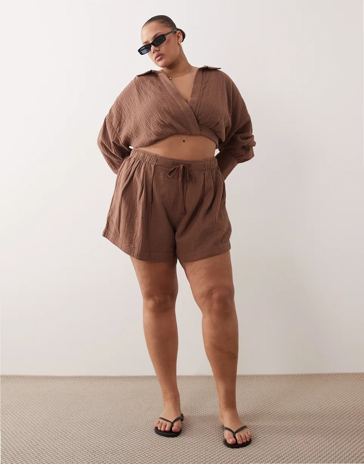 ASOS DESIGN Curve Callie cheesecloth beach paper bag waist shorts in mocha