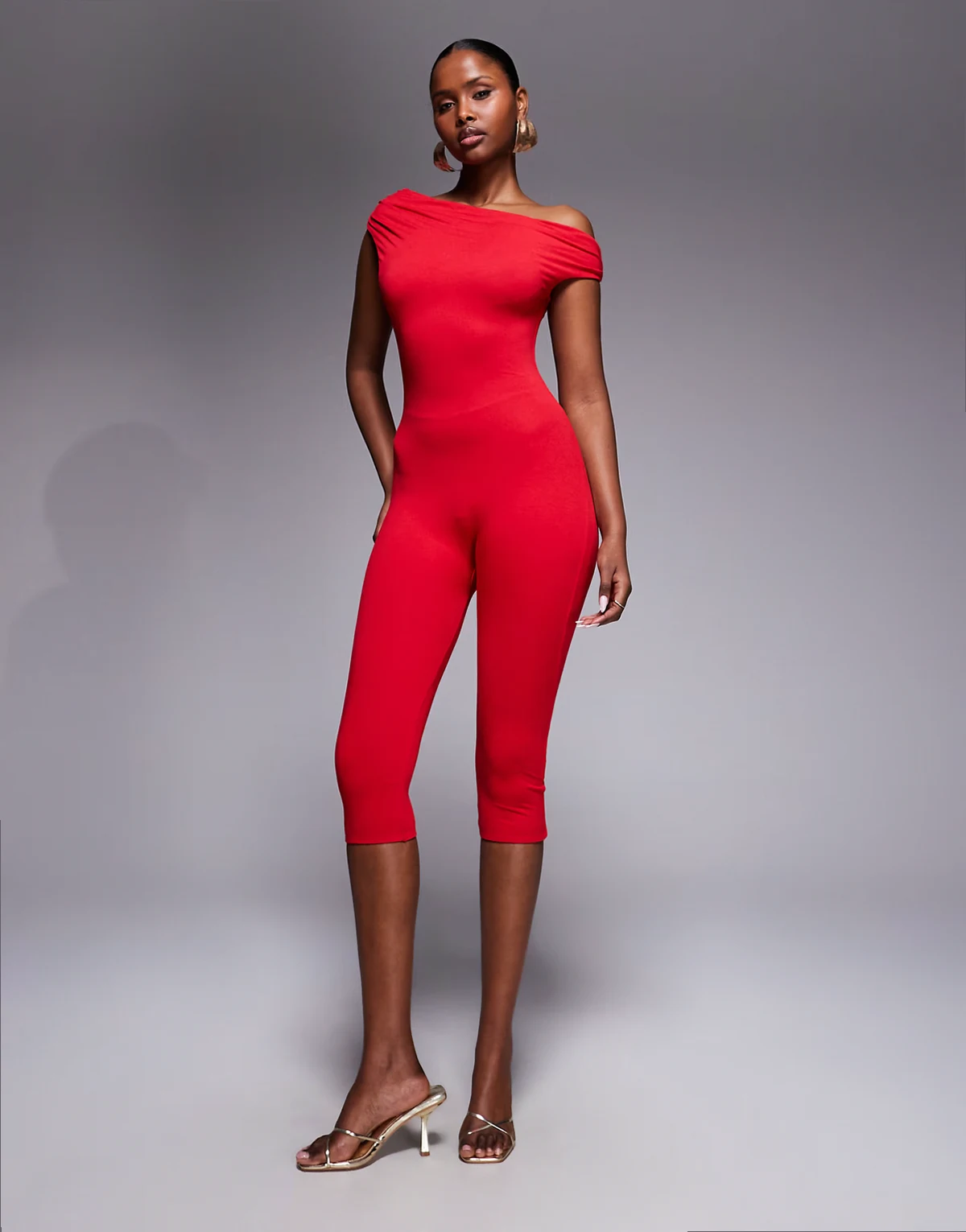 Gina asymmetric shoulders capri length jumpsuit in red