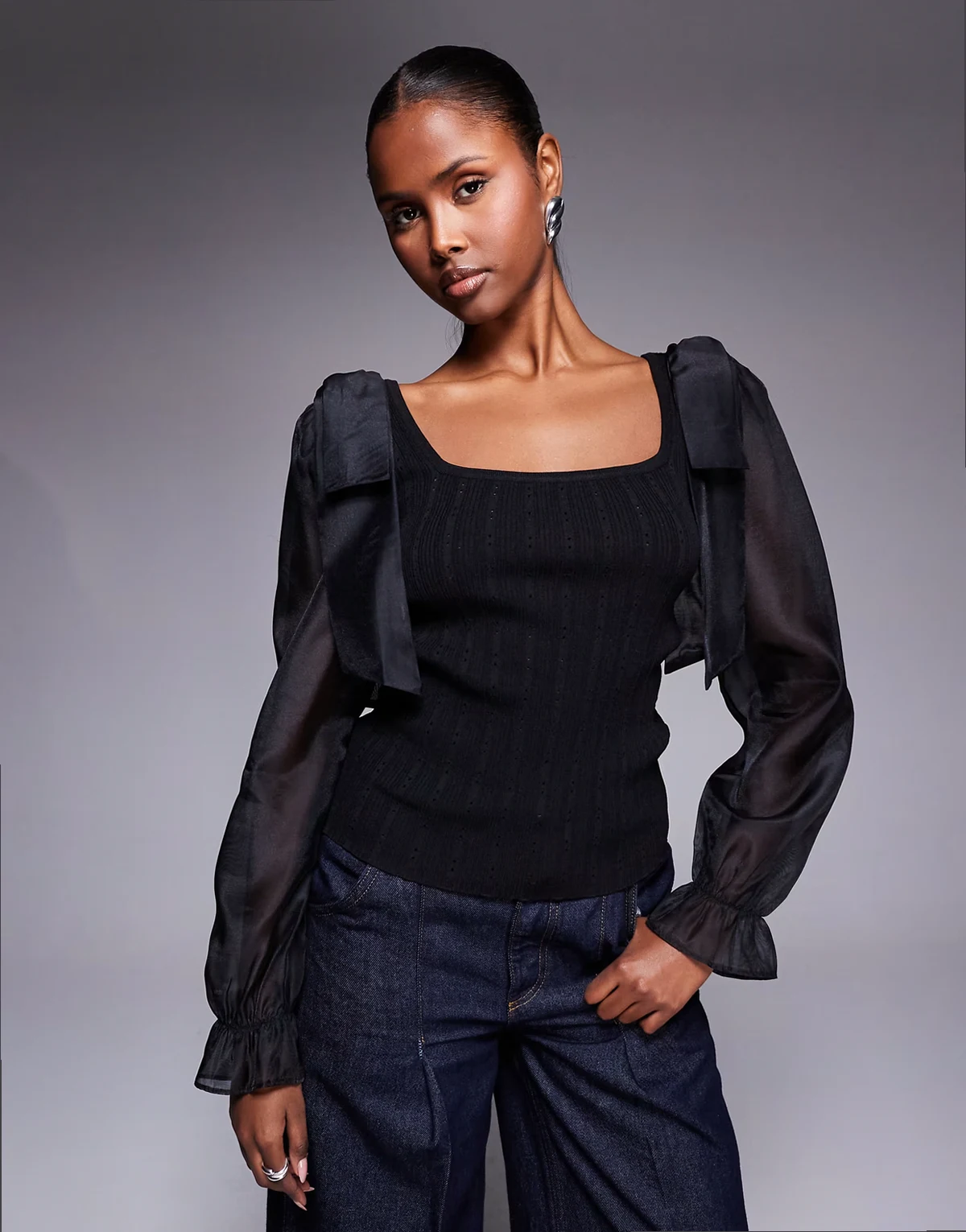 mesh sleeve knit top in black