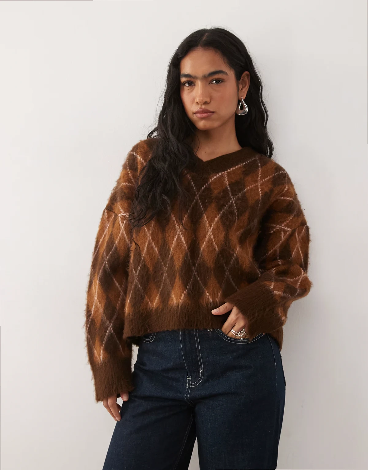 v-neck sweater in brown and orange argyle