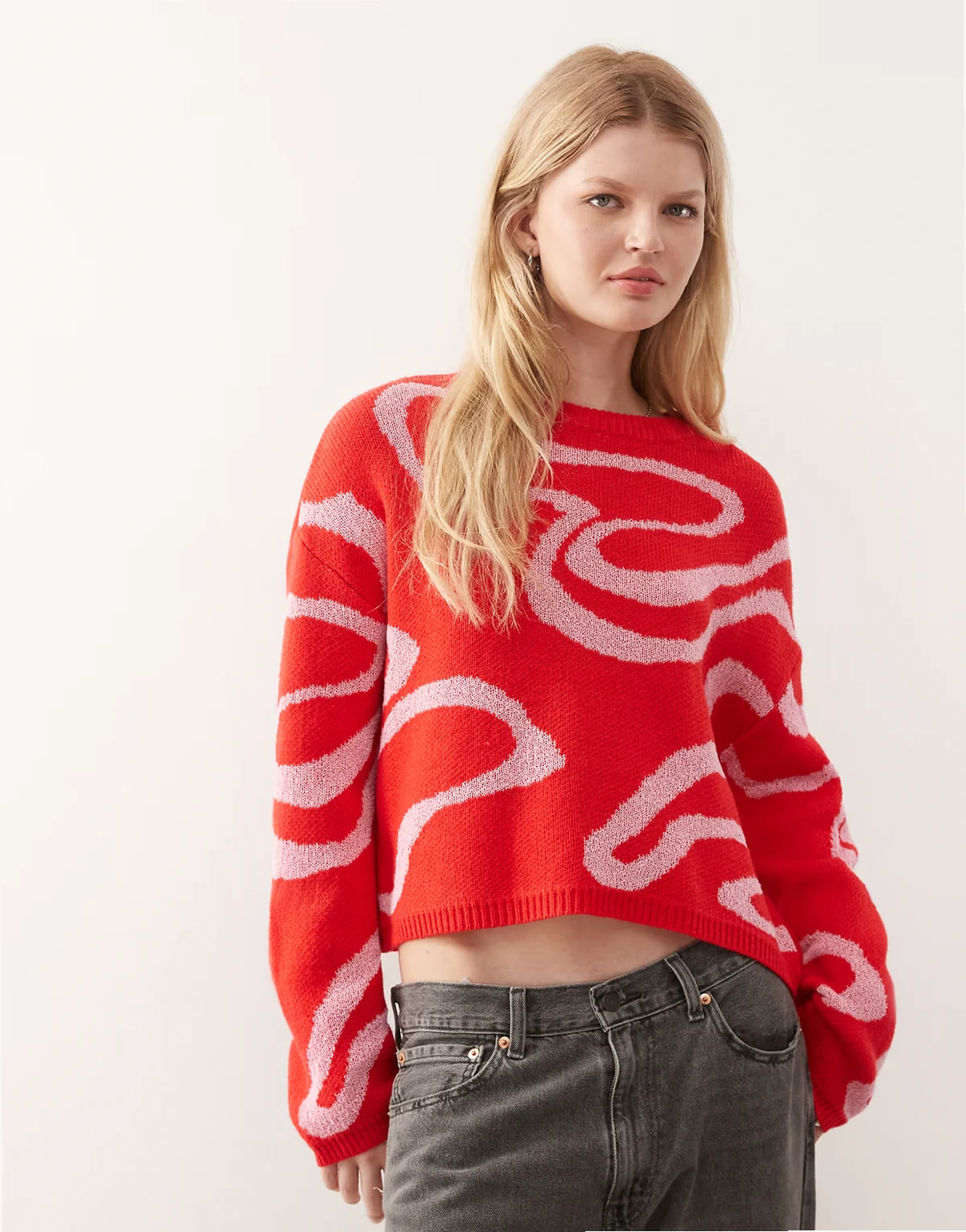 knit sweater in red with pink swirl