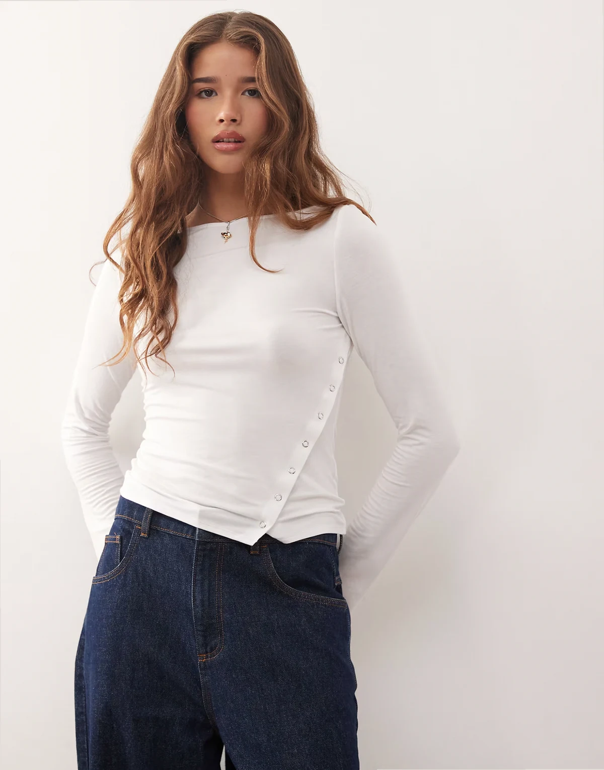 boat neck long sleeve top with snaps on split hem detailing in white