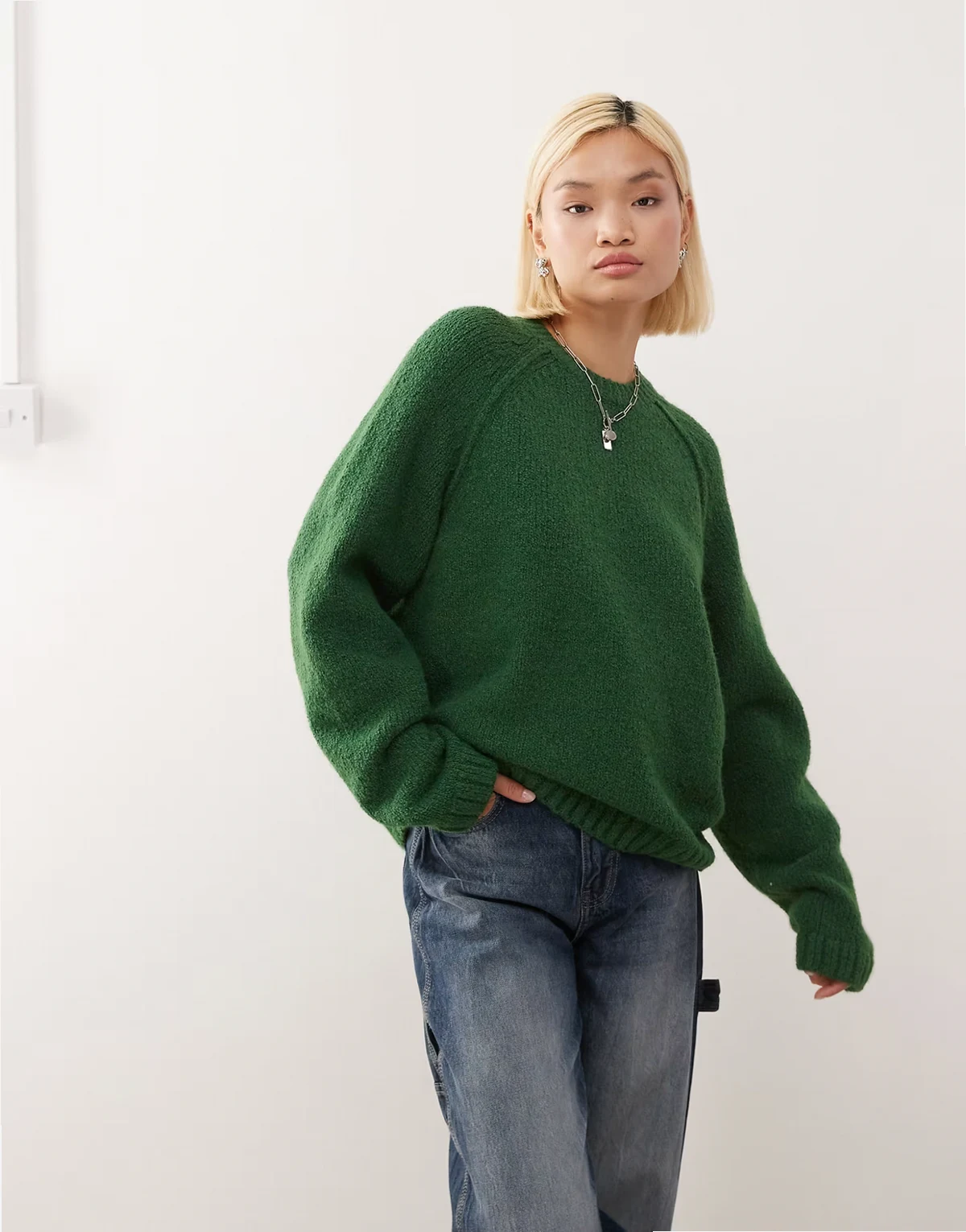 oversized sweater in slubby yarn with reversed seams in dark green