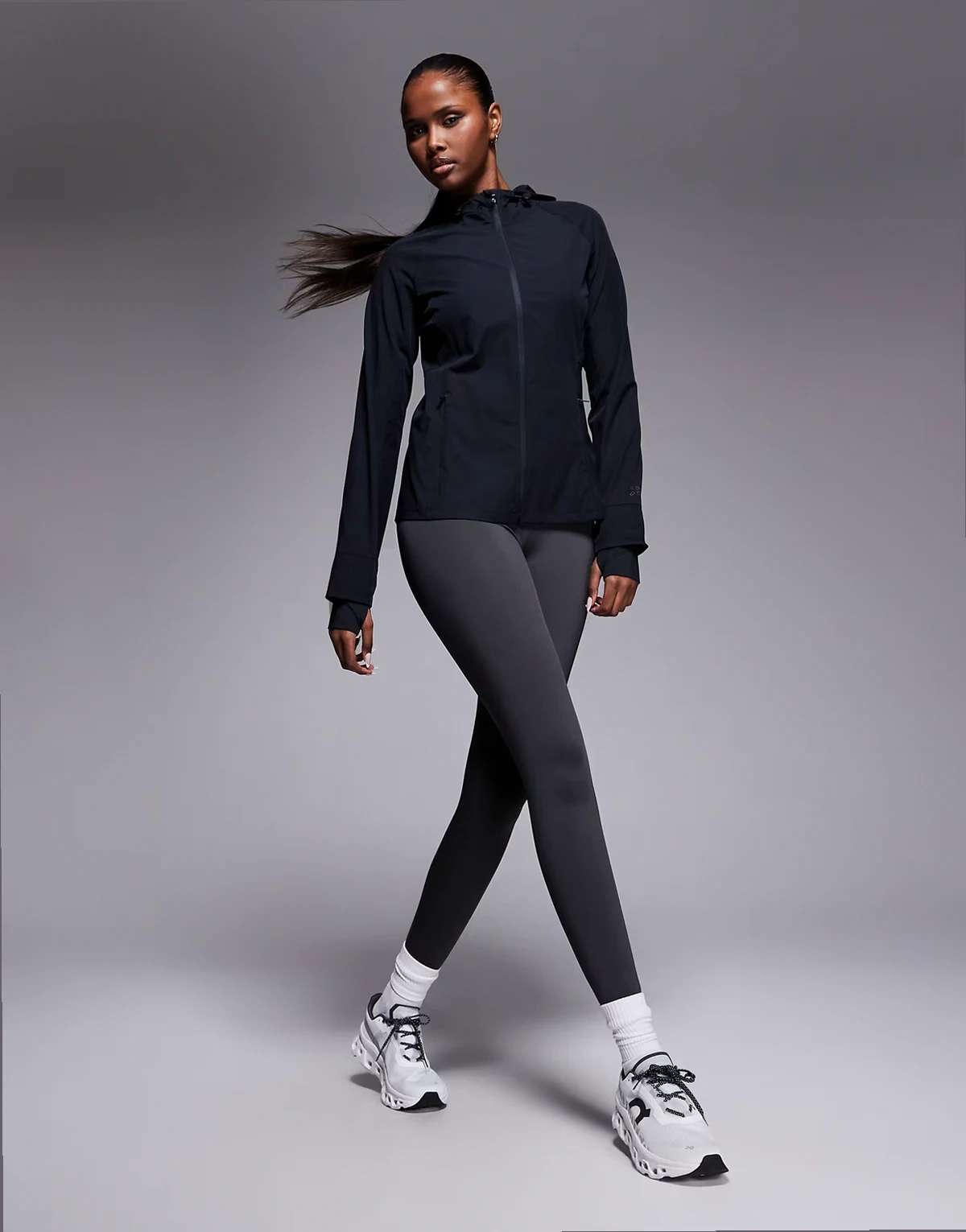 water repellent slim fit running jacket with hood and zip pockets in black