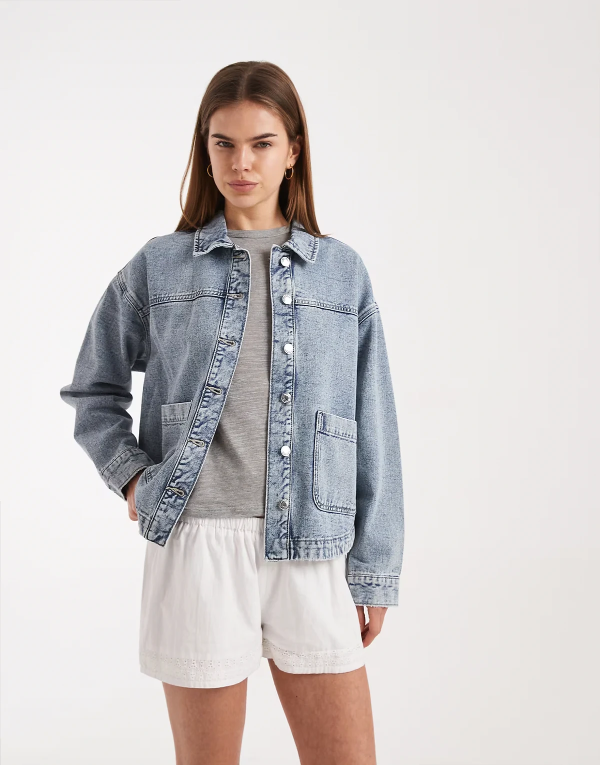 denim shacket with front pockets in light blue wash