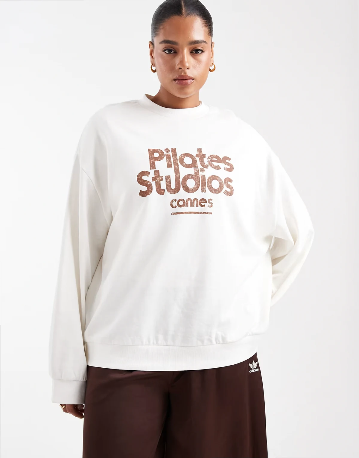 ASOS DESIGN Curve oversized sweatshirt with pilates studios graphic in cream