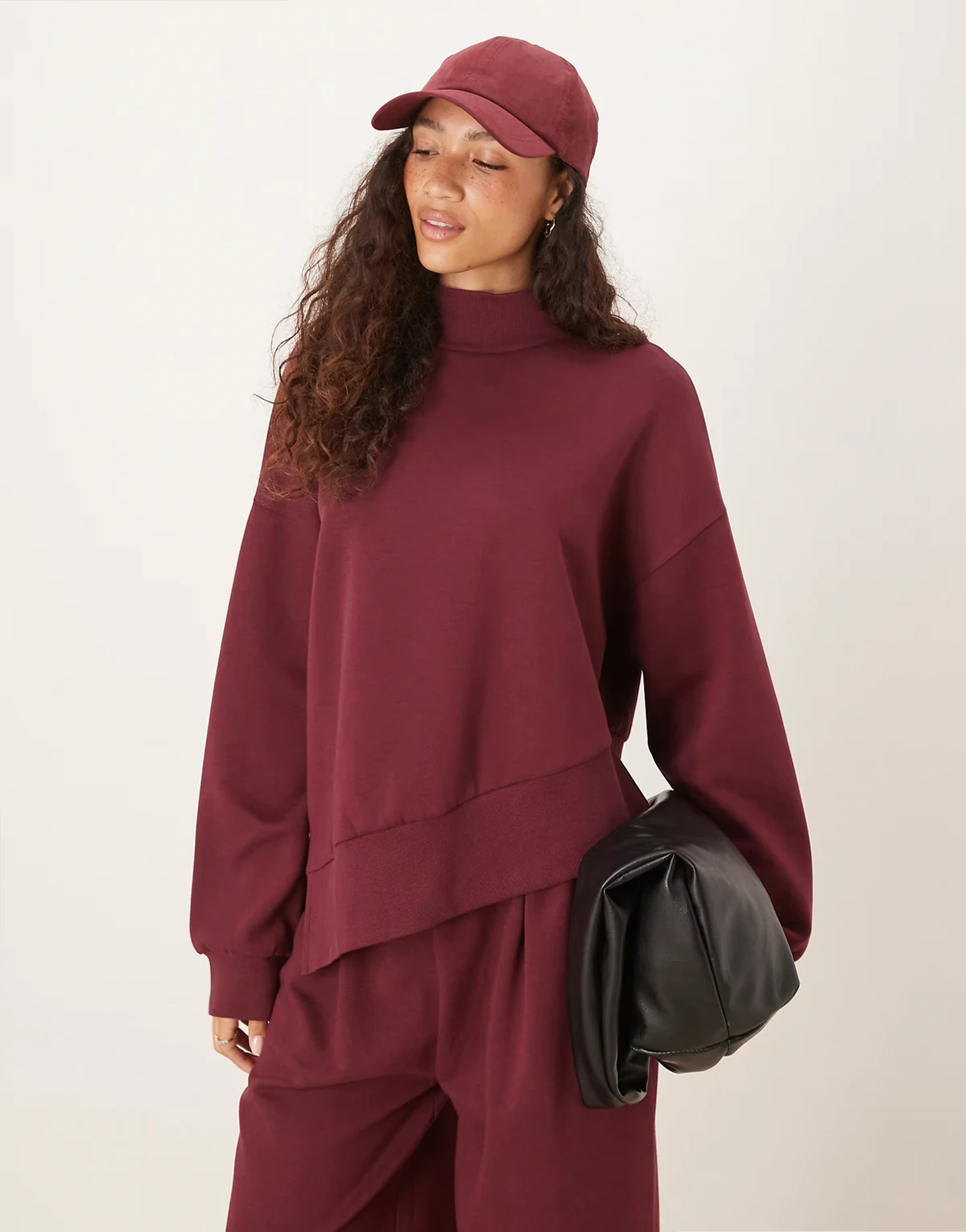 interlock funnel neck sweatshirt with asymmetric hem in plum