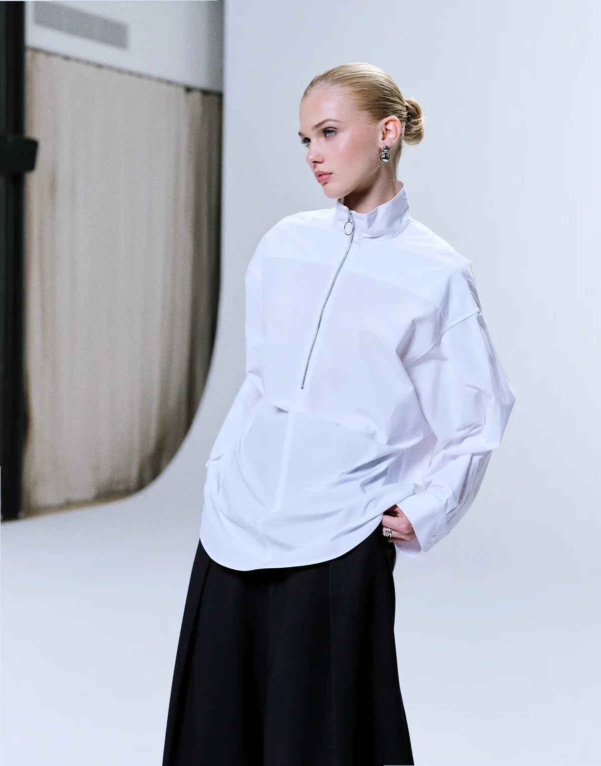 oversized high collar shirt with minimal zip front in white