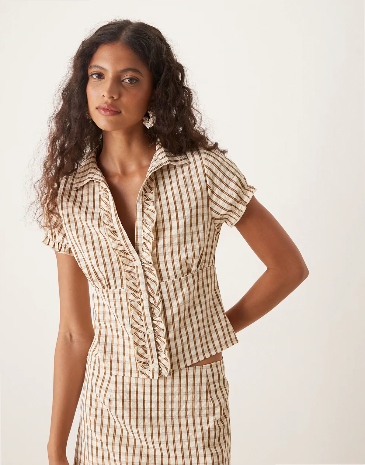 arla plaid print v-neck blouse in brown