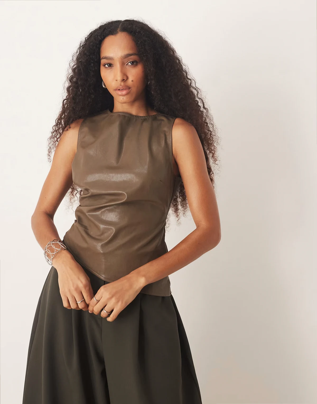 leather look sleeveless asymmetric hem top in khaki