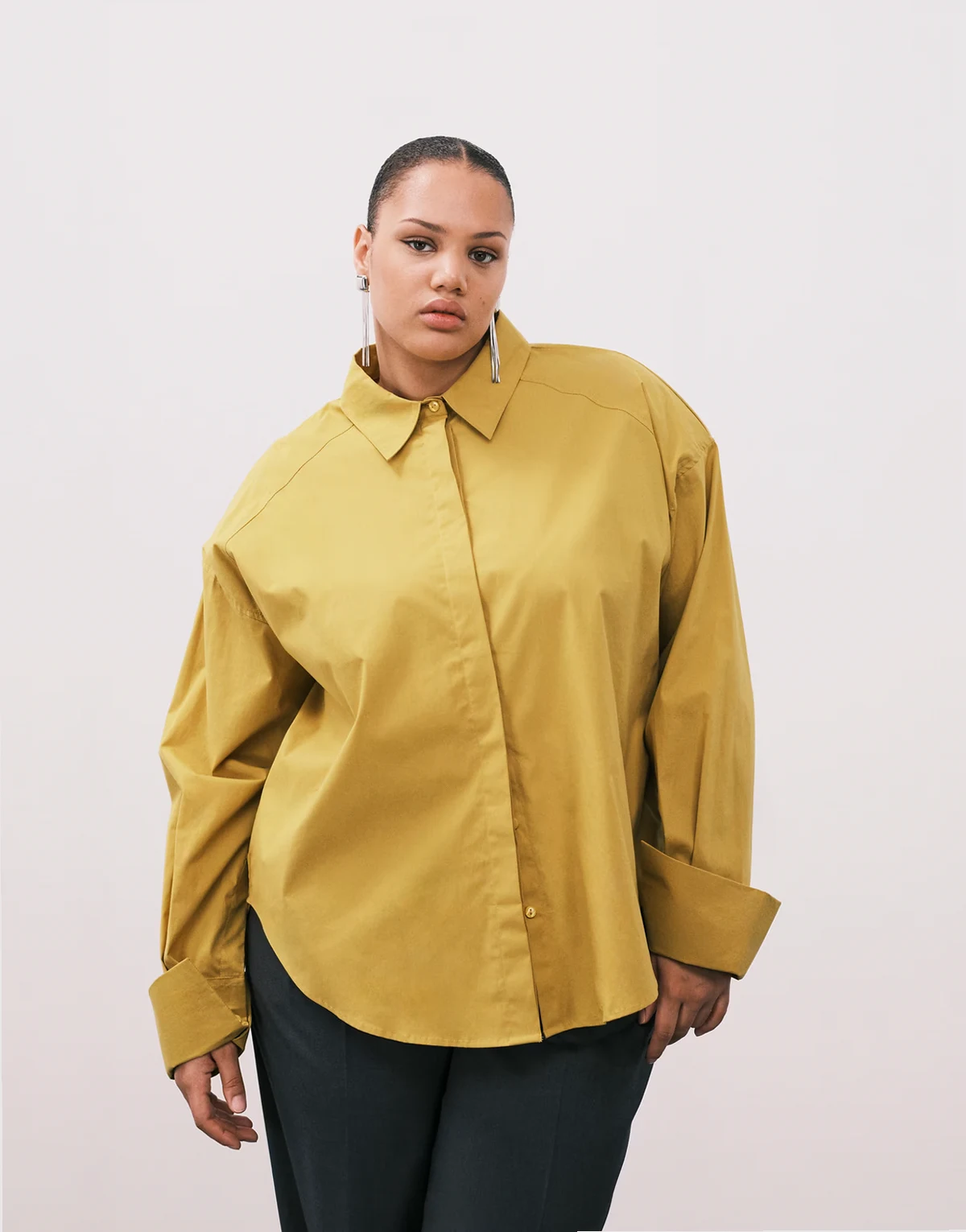 ASOS DESIGN Curve shoulder pads dipped hem shirt in mustard