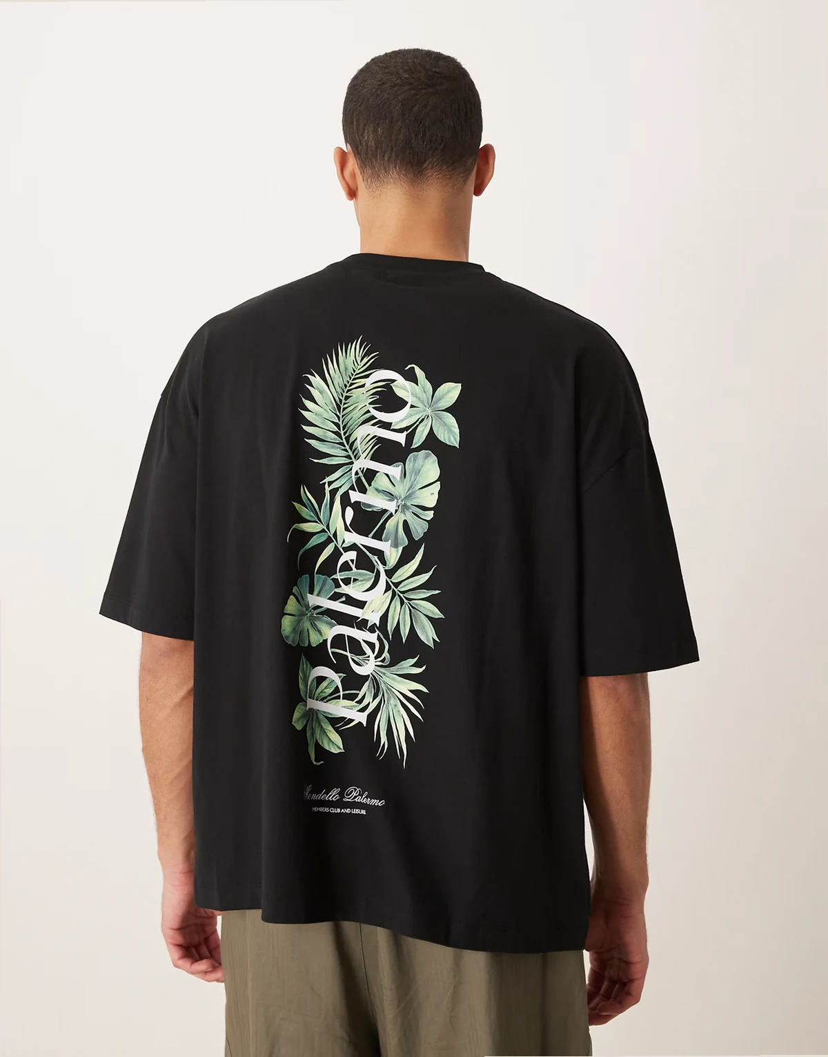 – Czarny T-shirt oversize z grafiką z palmami i napisem Palermo