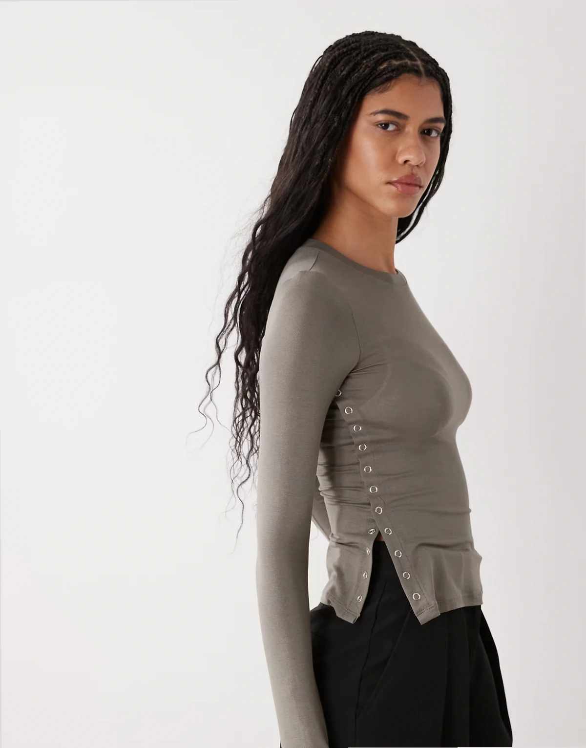 long sleeve fitted top with button detailing and asymmetric hem in gray