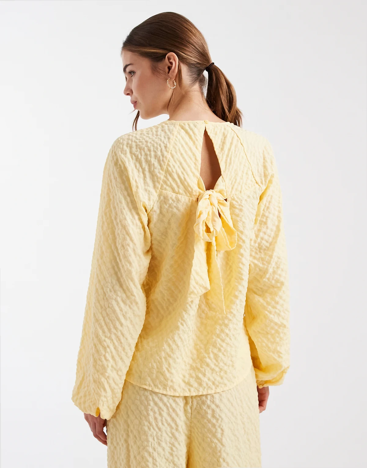 bow back textured long sleeve top in yellow - part of a set