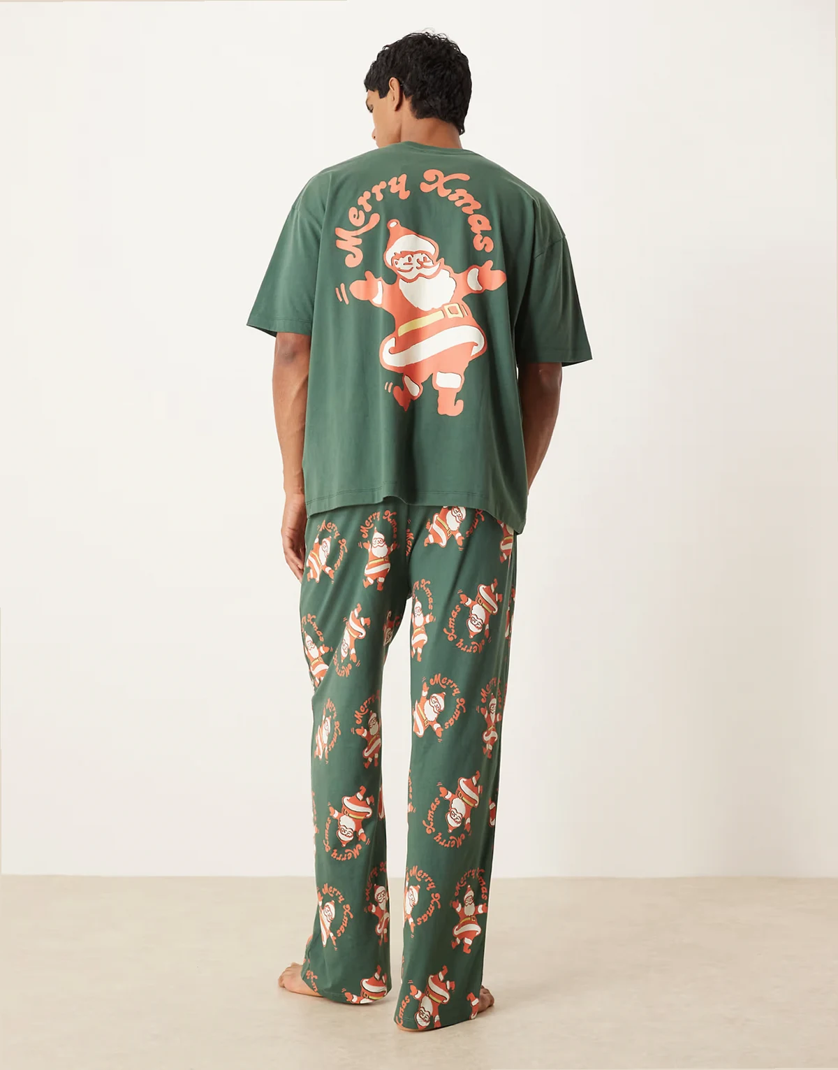 Christmas pajama set with vintage Santa graphics in green