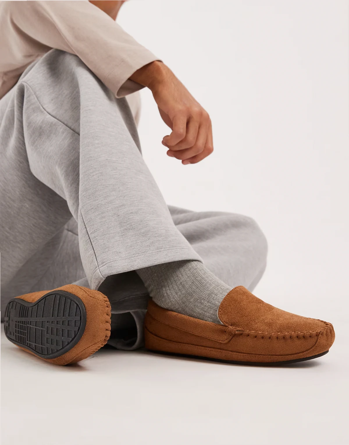 moccasin slippers in tan with faux fur lining
