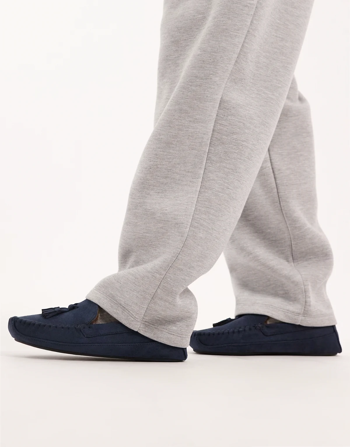 moccasin slippers in navy with faux fur lining with tassel