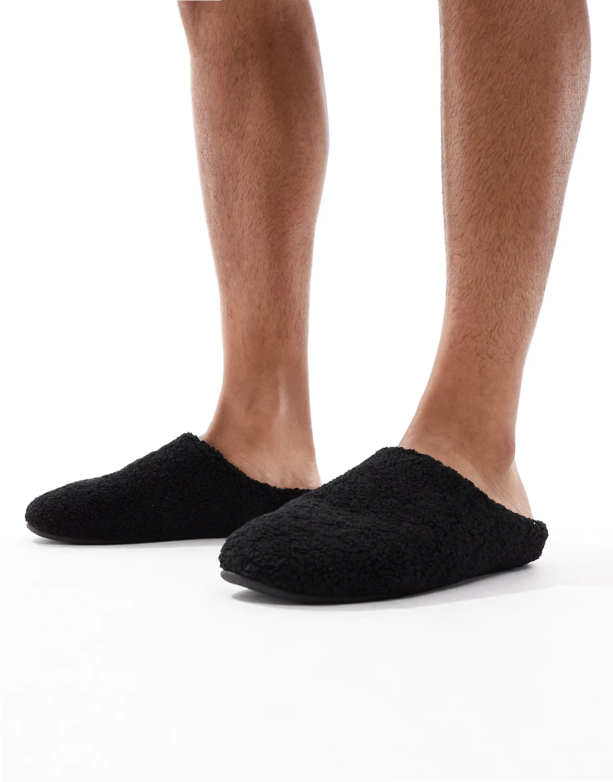 mule slippers in black borg