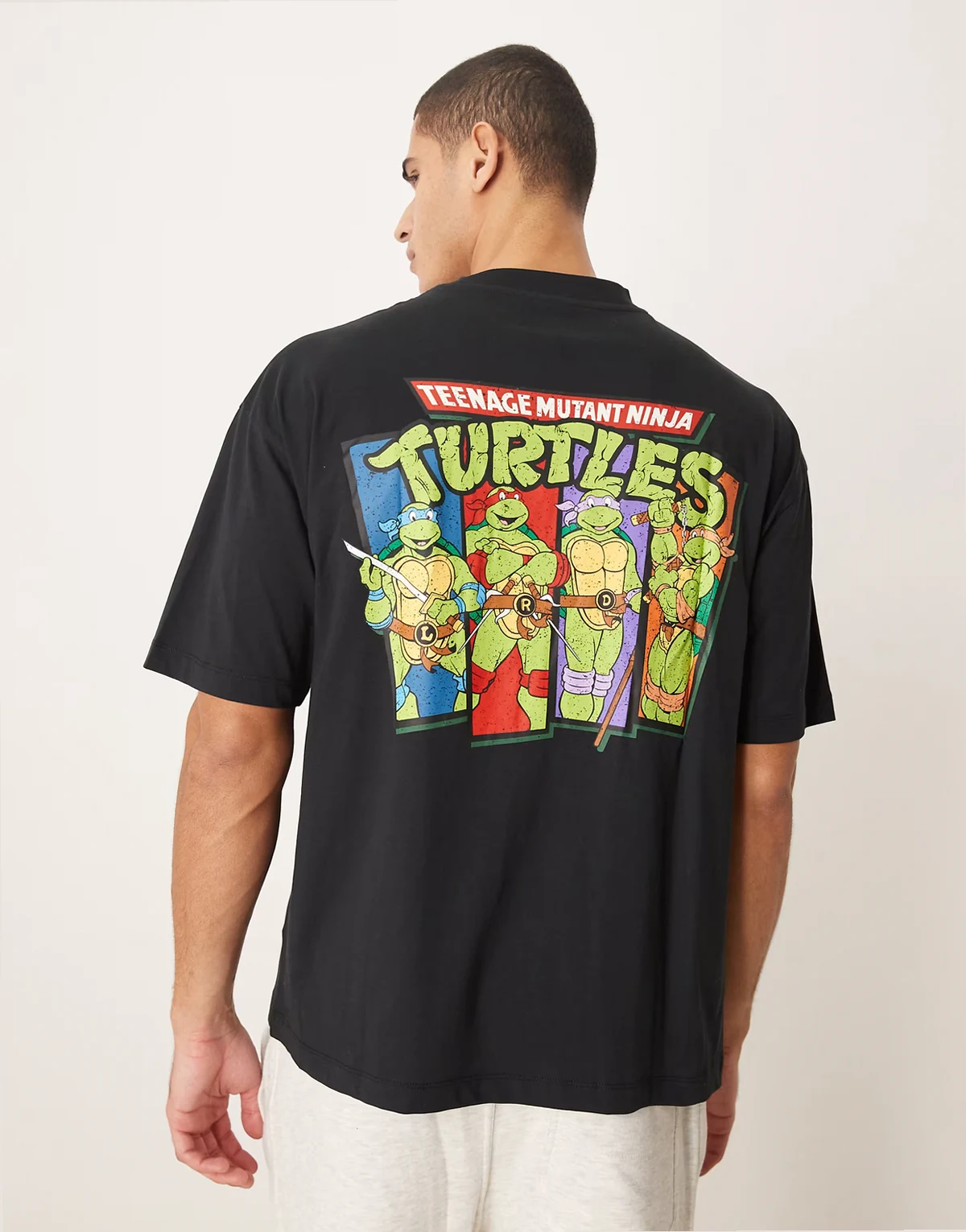 unisex oversized T-shirt with Ninja Turtles vintage prints in black