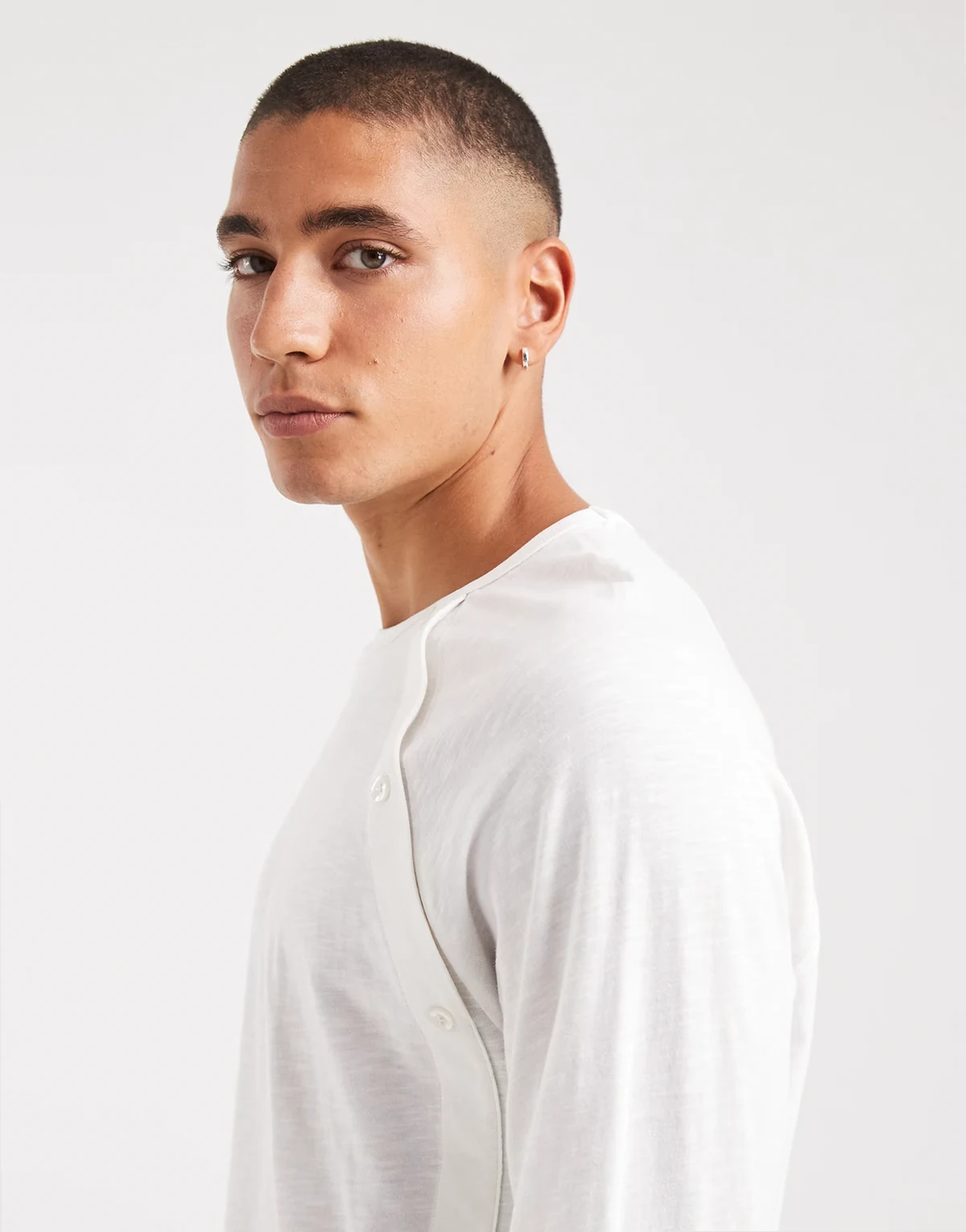 long sleeve henley with asymmetric buttons in ecru