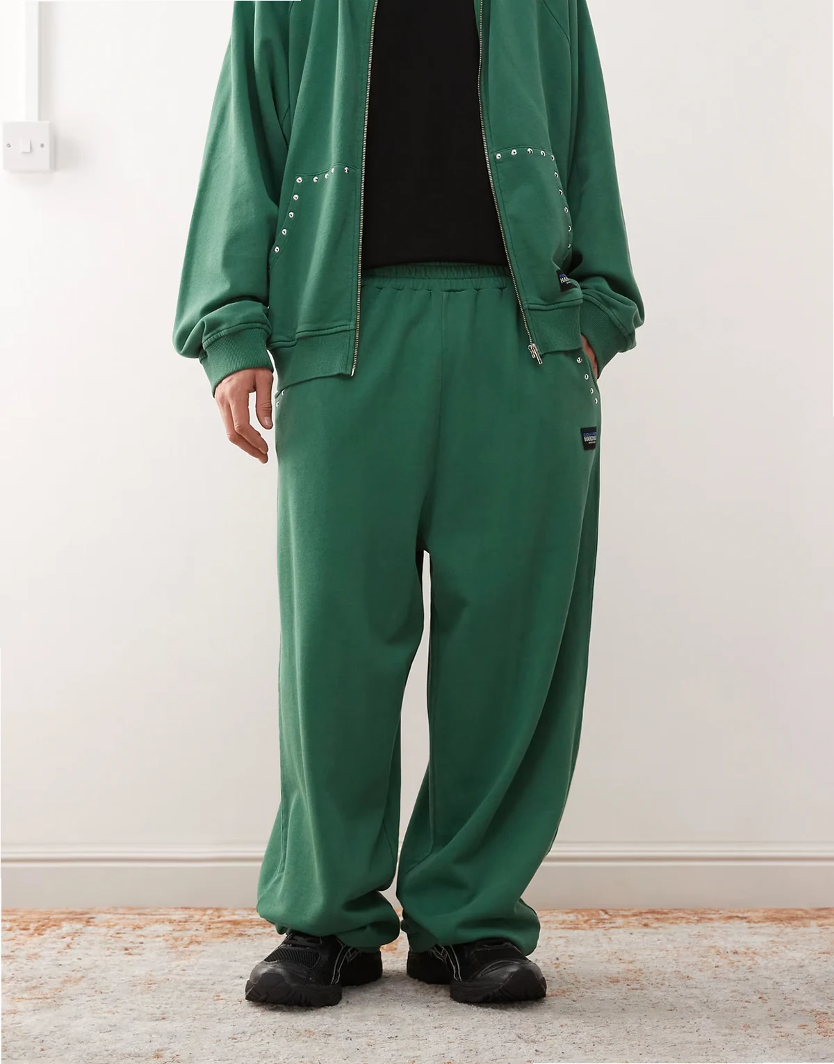 relaxed sweatpants in green with studded detailing