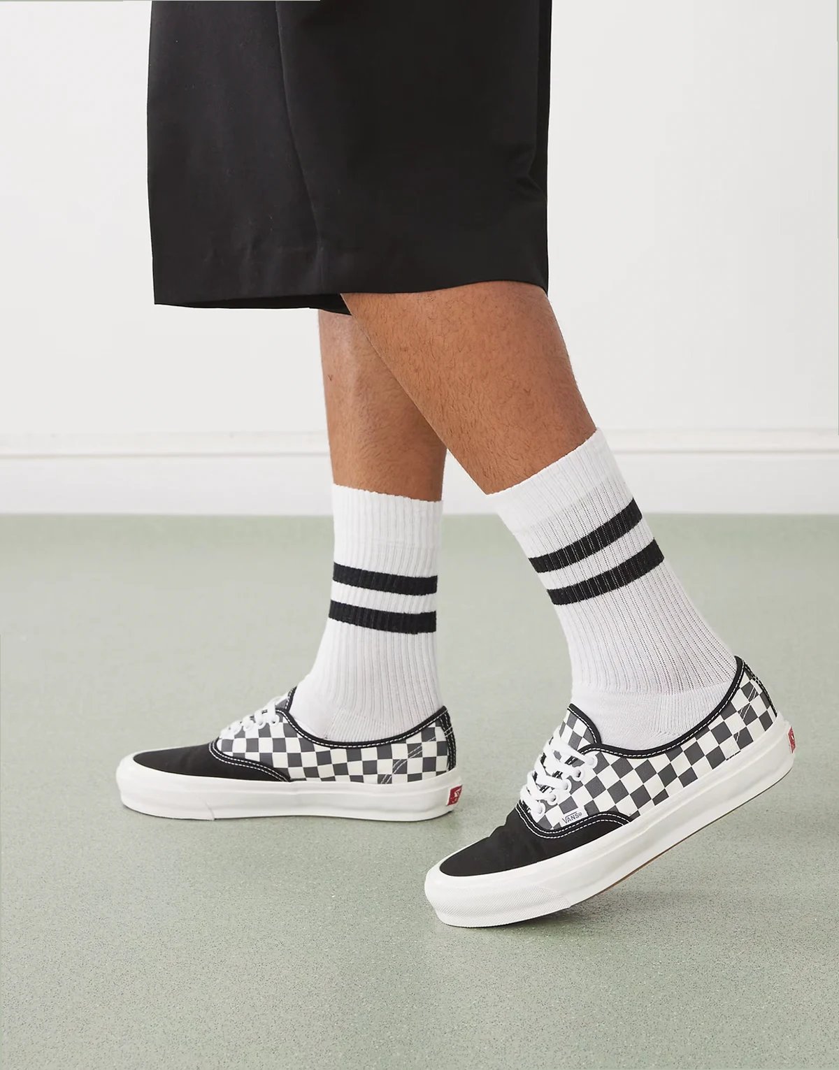 Authentic sneakers in black and white checkerboard