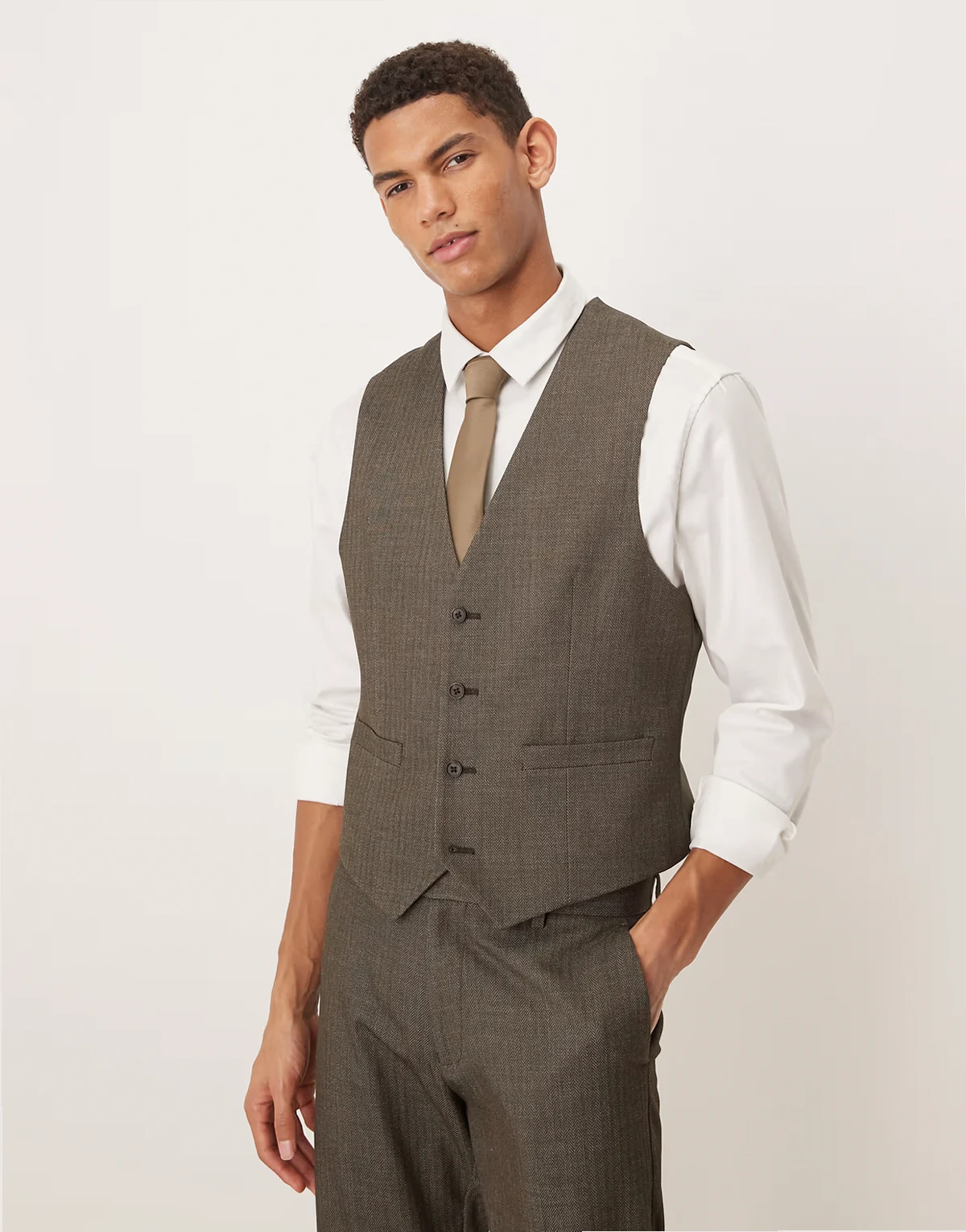 – Eng geschnittene Anzugweste in Dunkelgrün mit Fischgrätmuster und Wolloptik