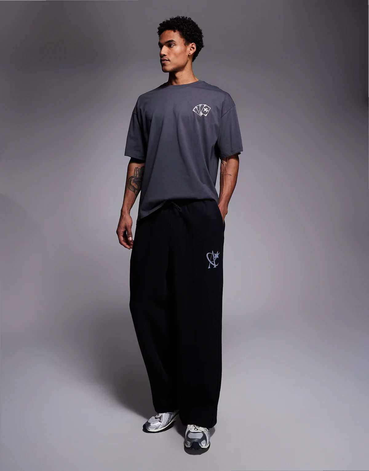 loose fit sweatpants with star logo in washed black