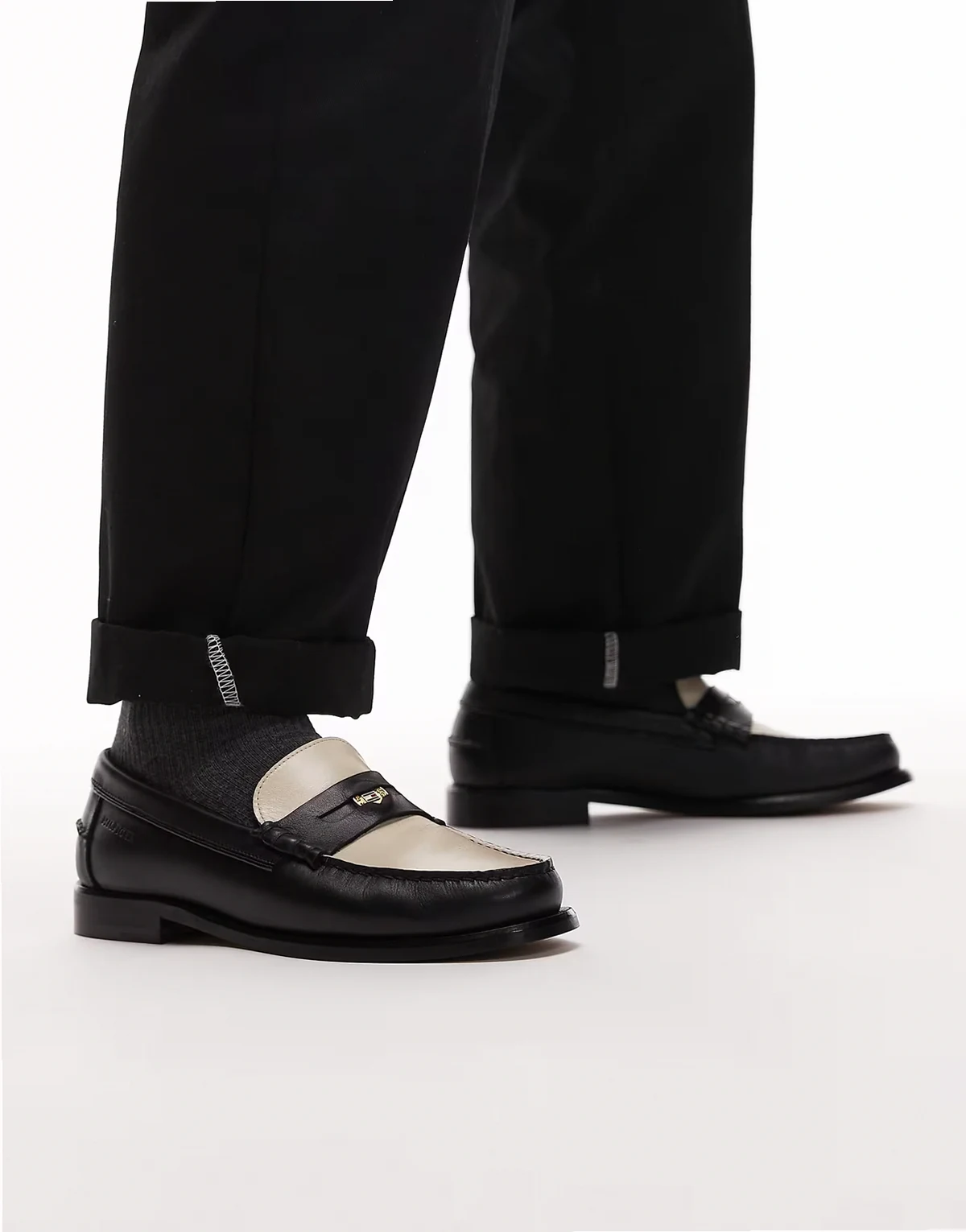 leather penny loafers in black and white