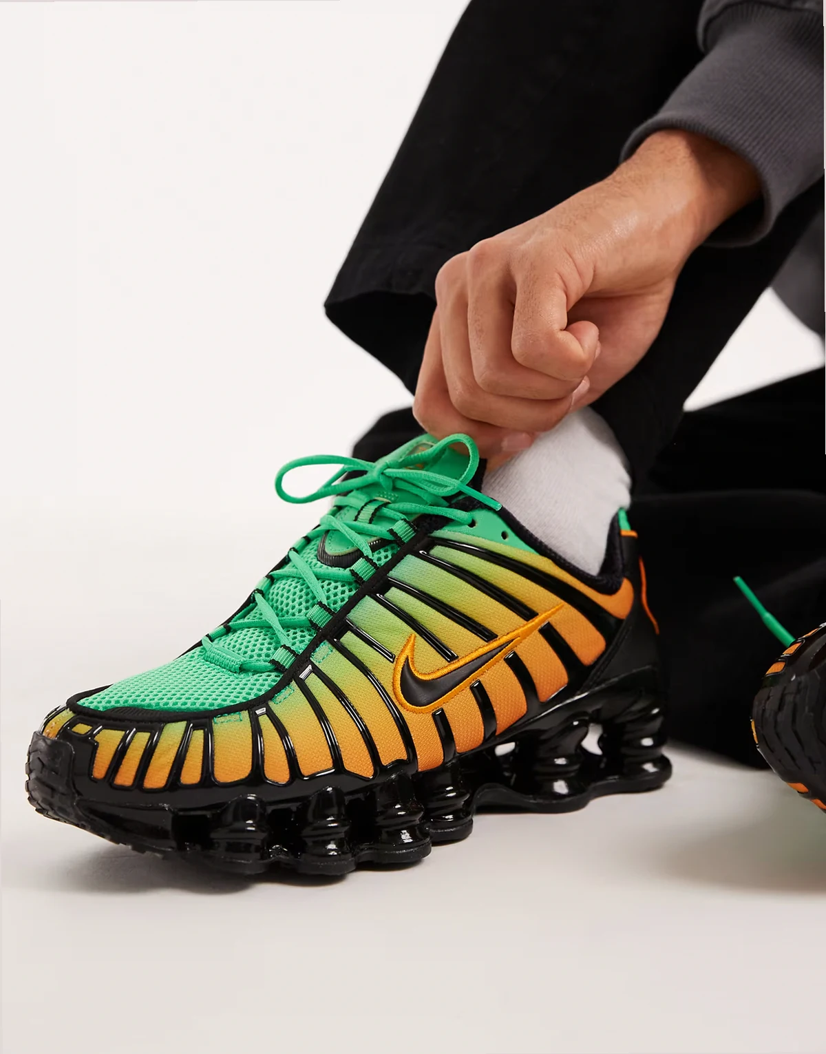 Shox TL sneakers in black, green and orange