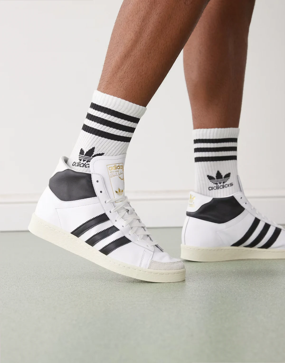 Jabbar high top sneakers in white and black