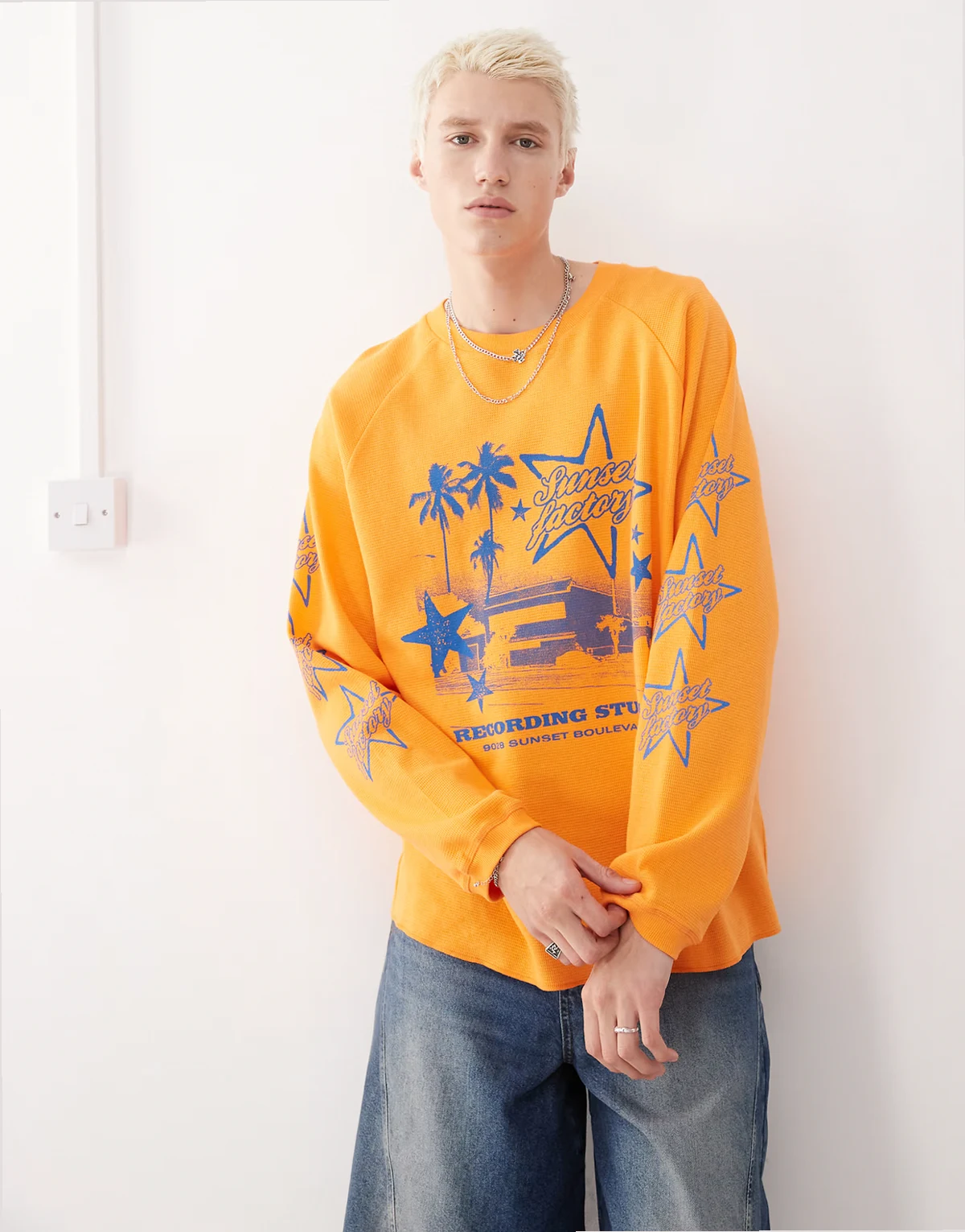 Long sleeve skater fit T-shirt in orange with blue print