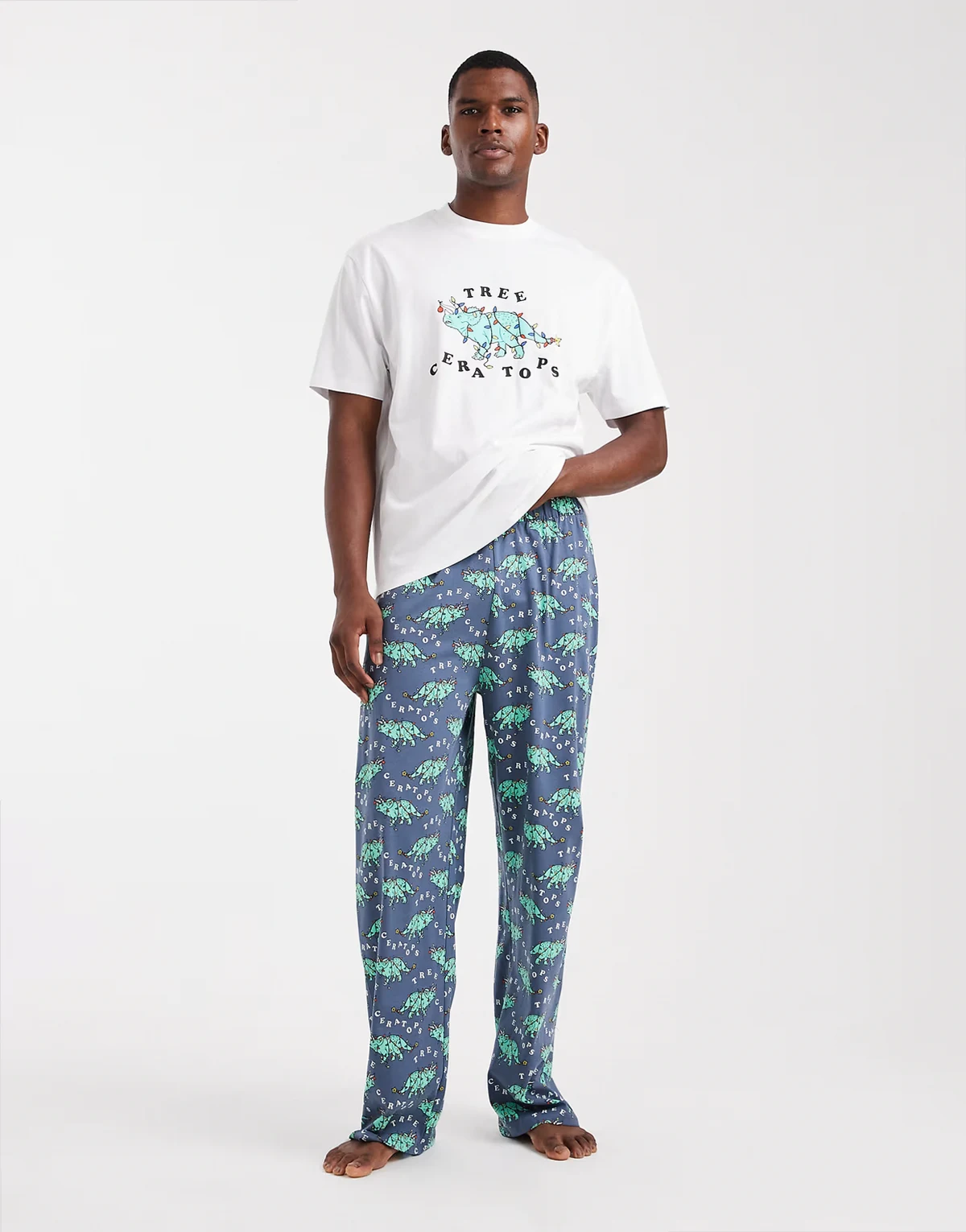Christmas pajama set with dinosaur graphic in navy