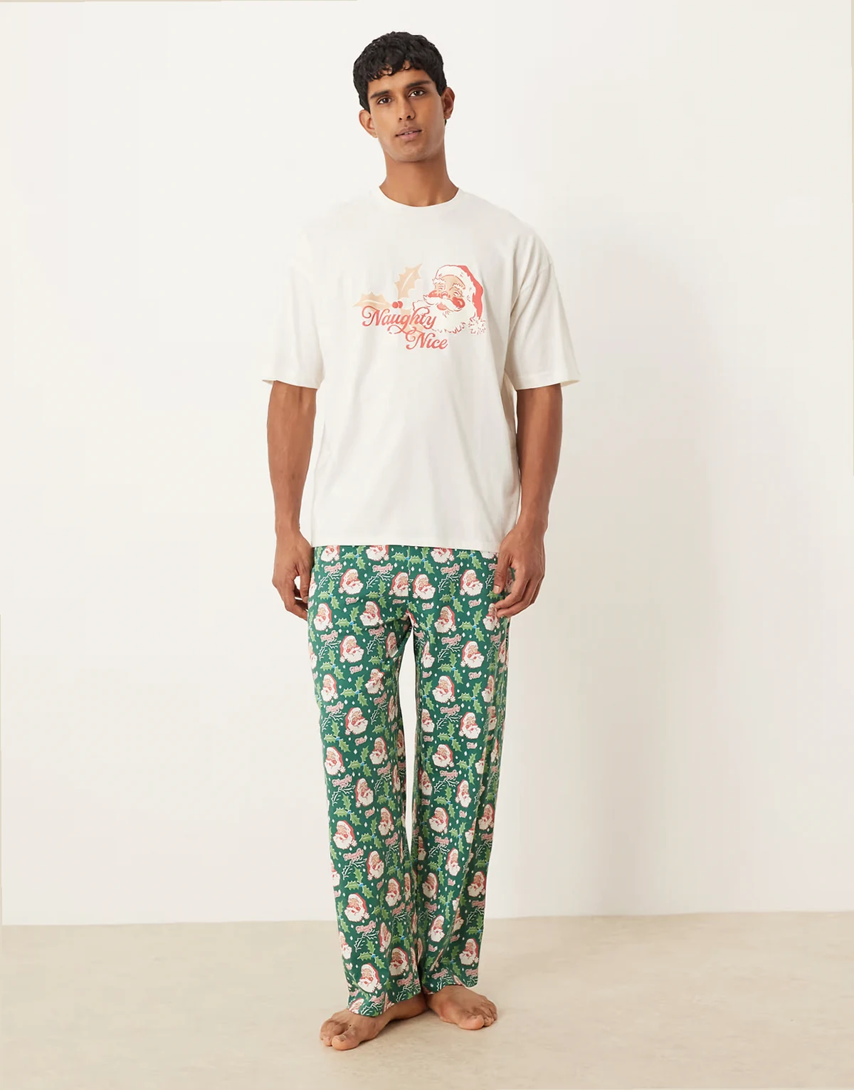 Christmas pajama set with retro Santa graphics in blue