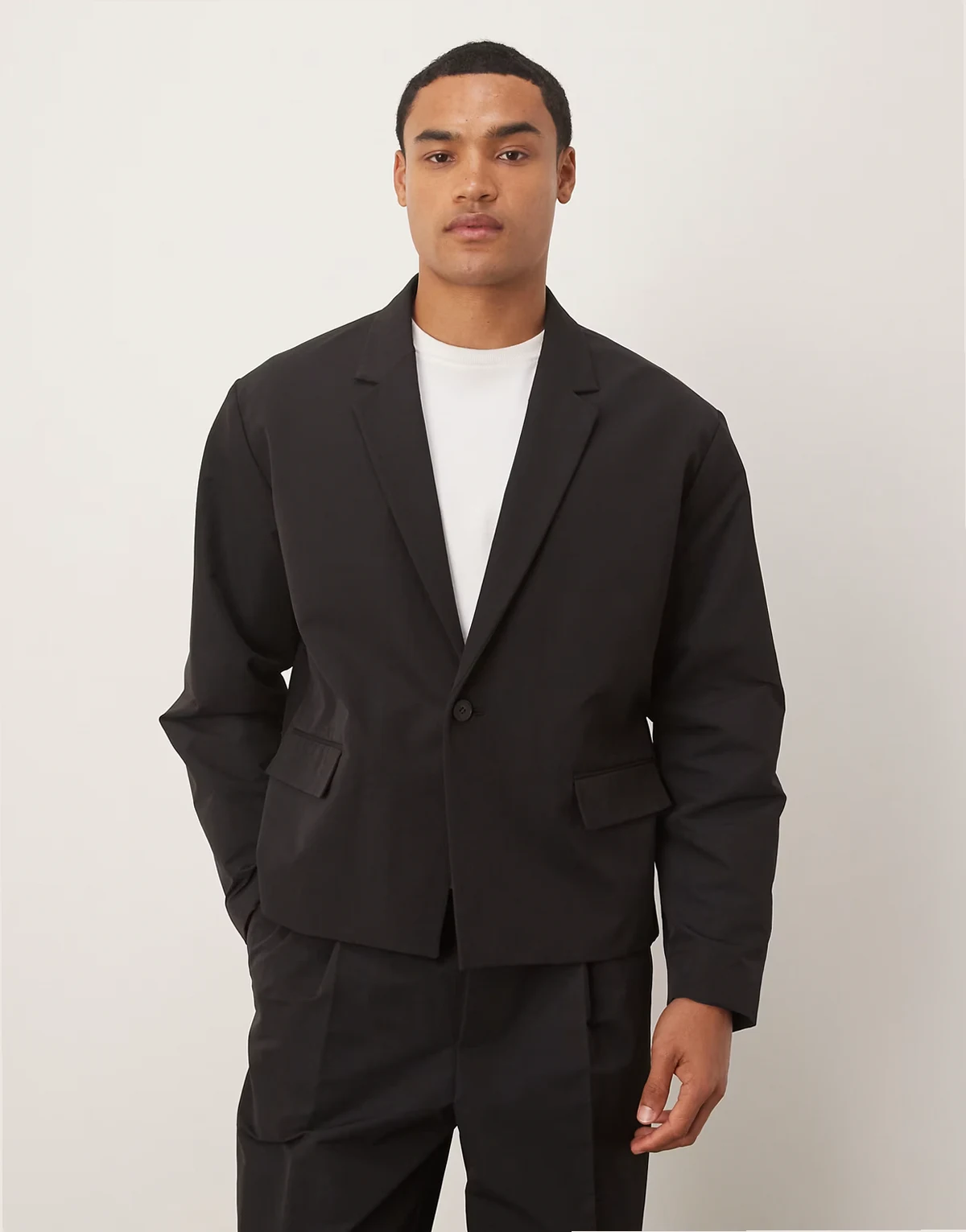 boxy suit jacket in casual black tech fabric