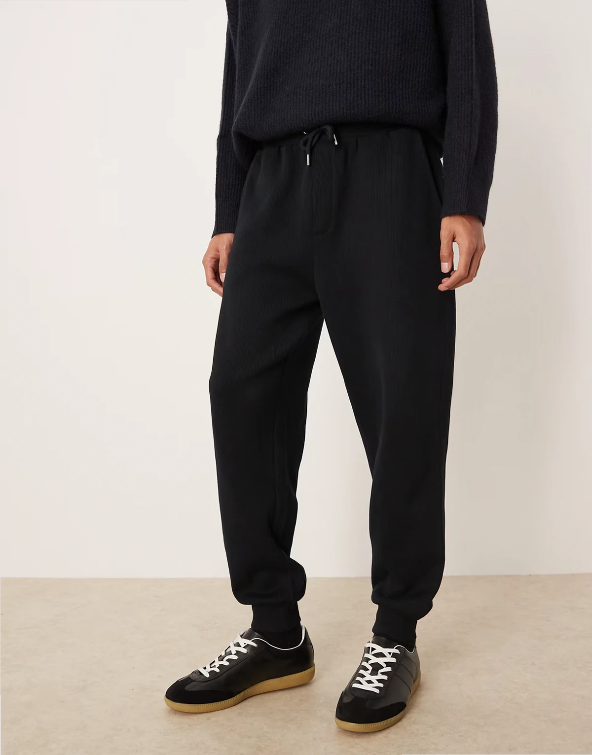 tapered cuffed sweatpants in black